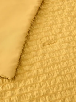Beddensprei van kreukstof met textuur