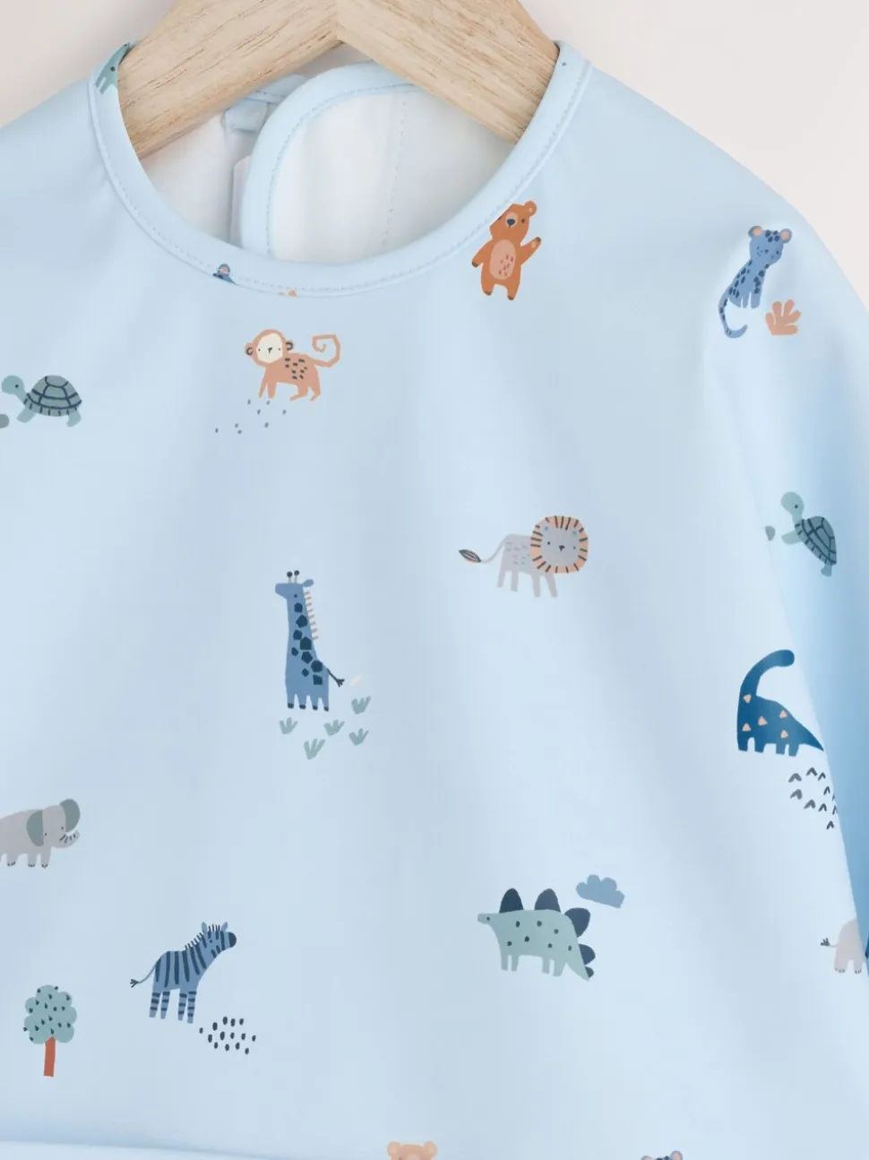 Blauw Dino Jungle - Slabbetje met mouwen voor spenen en voeden