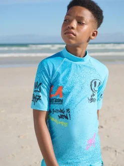Blauw met graffitiprint - Surfhemdje (1,5 - 16 jr)