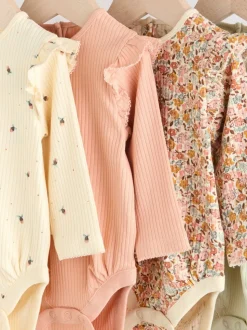 Blauw/crème/koraal Ditsy - Verpakking van 4 babyrompers met lange mouwen en ruches (0mnd-2jr)