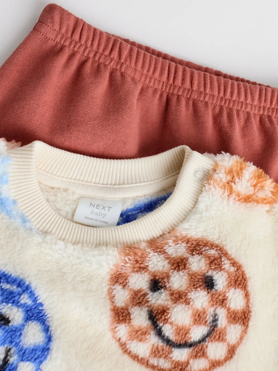 Blauwe gezichten met dambordmotief - Set van fleece top en joggingbroek voor baby's (0mnd -2jr)