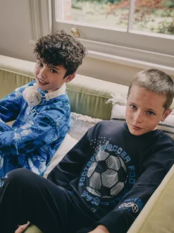 Blauw/zwart met voetbal - Verpakking van 2 pyjama's met lange mouwen (3-16 jr)