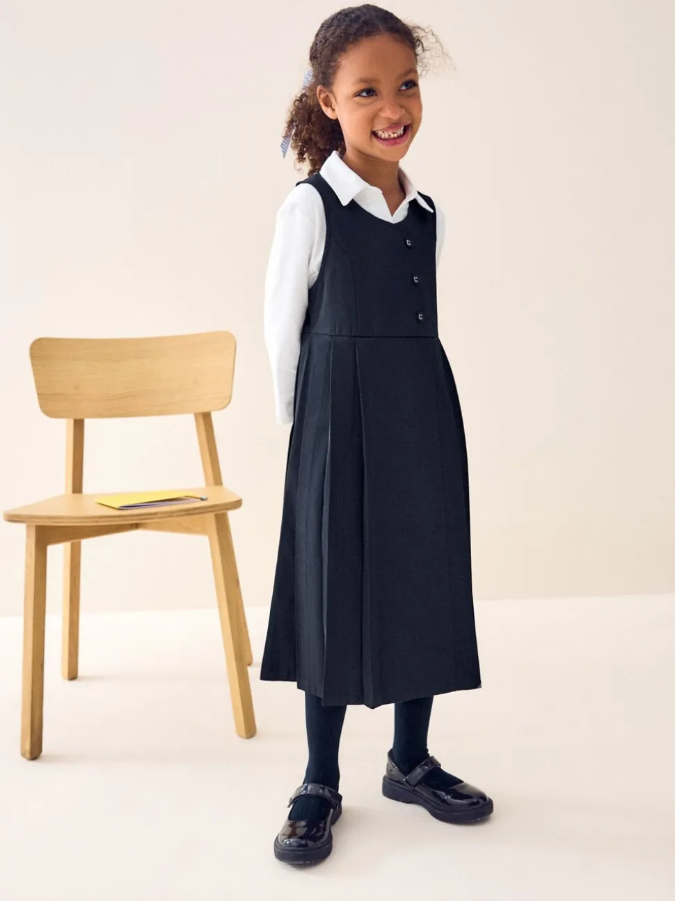 Donkerblauw - Asymmetrische lange schoolovergooier met knoopsluiting aan de voorkant (3-14jr)