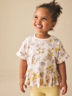 Ecru met bloemenprint - T-shirt met peplum en korte mouwen (3mnd -7jr)