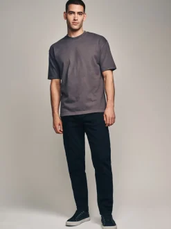 Effen zwart - Klassieke stretchjeans met standaard taps toelopende pasvorm