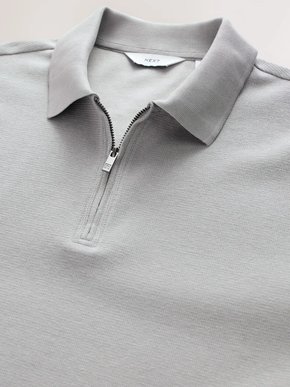 Grijs - Smart poloshirt met textuur en rits