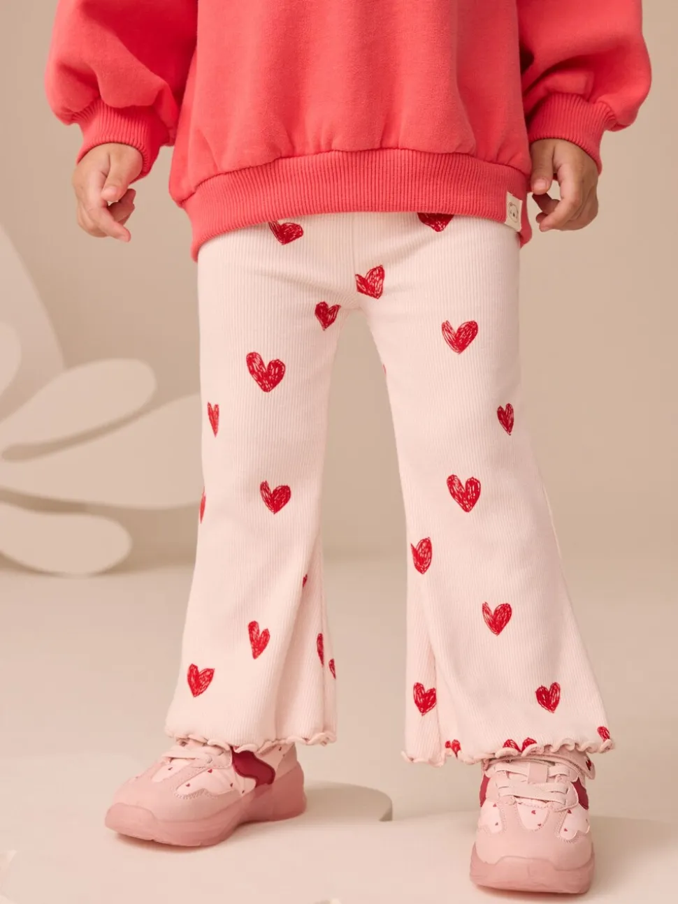Lichtroze met hartje - Geribbelde flare legging (3 mnd-7 jr)