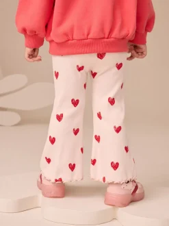 Lichtroze met hartje - Geribbelde flare legging (3 mnd-7 jr)