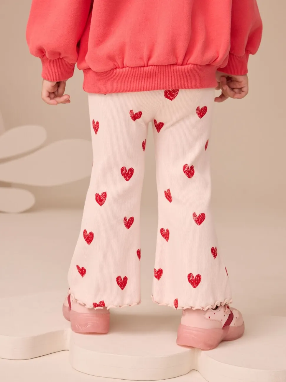 Lichtroze met hartje - Geribbelde flare legging (3 mnd-7 jr)