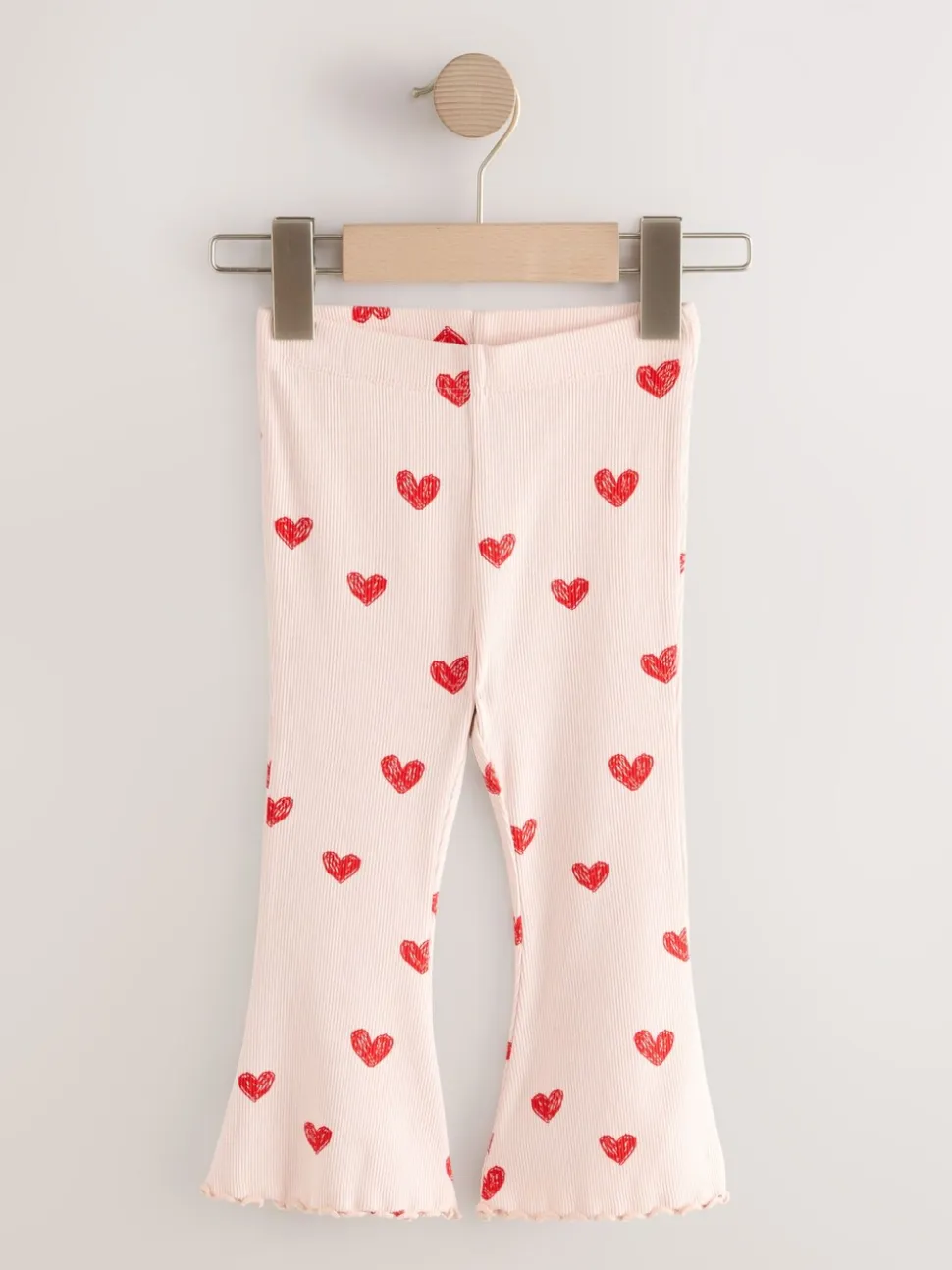 Lichtroze met hartje - Geribbelde flare legging (3 mnd-7 jr)