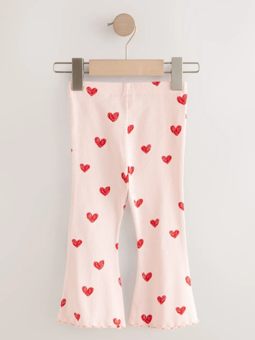Lichtroze met hartje - Geribbelde flare legging (3 mnd-7 jr)