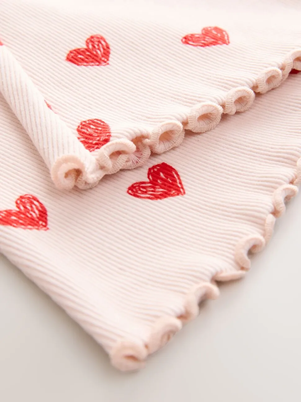 Lichtroze met hartje - Geribbelde flare legging (3 mnd-7 jr)