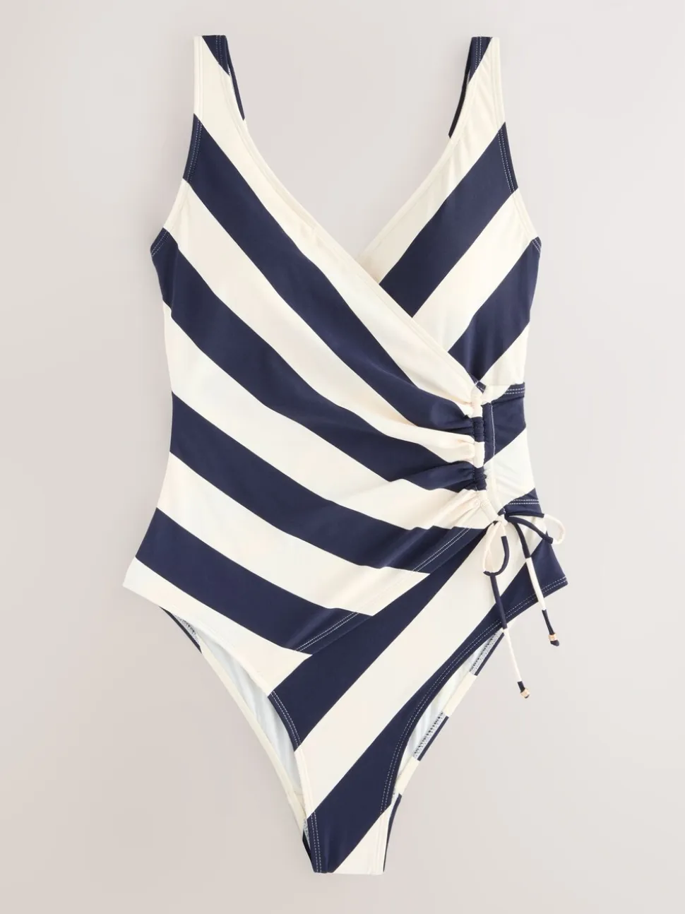 Marineblauw/crèmekleurig - Badpak met vormgevende zijrimpeling en buikcorrectie