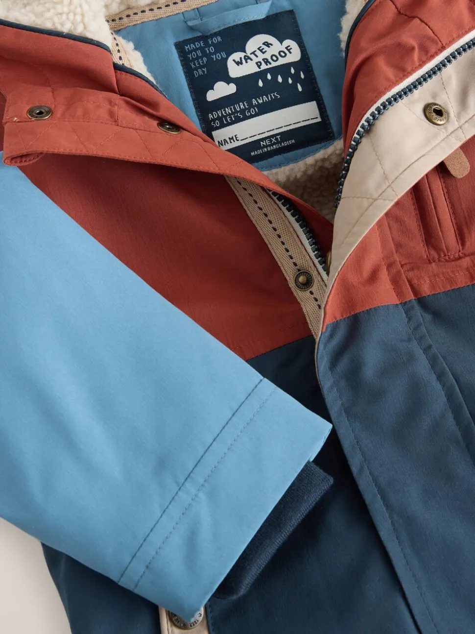Marineblauw/rood met kleurvlakken - Waterdichte parka met borgvoering (3mnd -7jr)