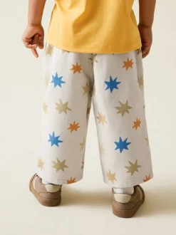 Meerkleurige sterrenprint - Wijde broek met elastische taille (3mnd-7jr)
