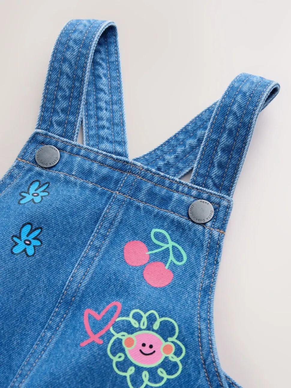 Middenblauw met figuur - Denim overgooier (3 mnd-8 jr)