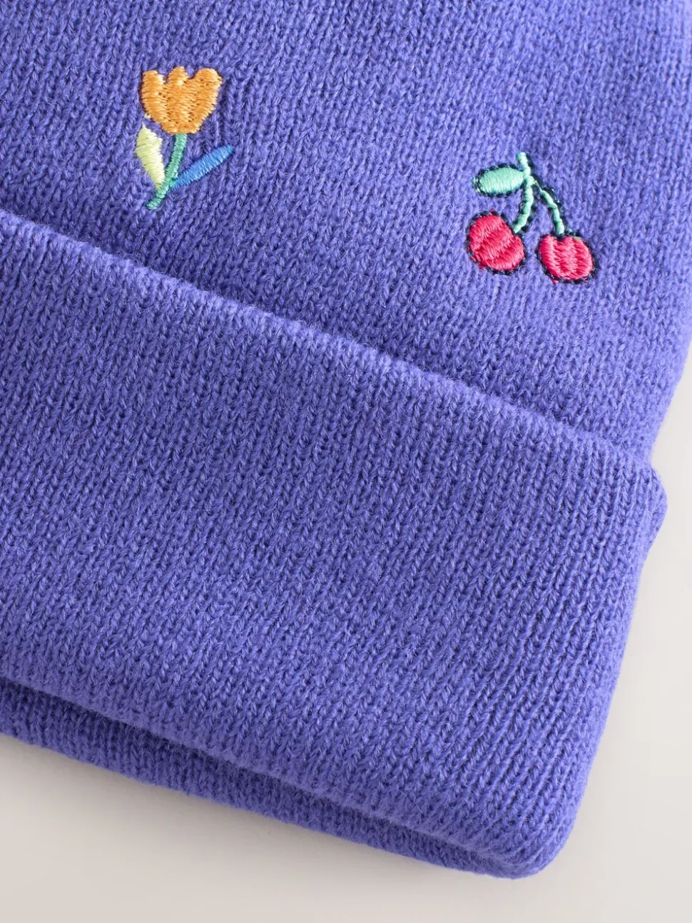 Multi - Geborduurde Beanie-muts met pompon (3mnd-10jr)