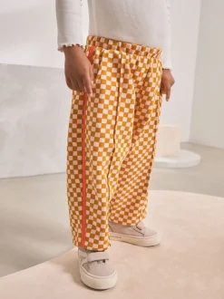 Oranje met dambordmotief - Broek met wijde kortere pijpen (3mnd -7jr)