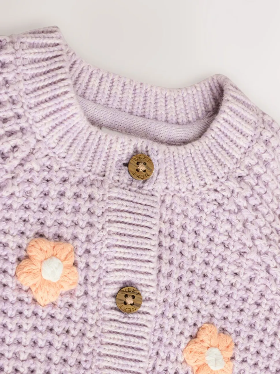 Paarse en abrikozenkleurige bloemen voor baby's - Geborduurd vest (0 mnd - 2 jr)
