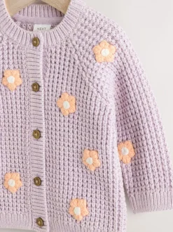 Paarse en abrikozenkleurige bloemen voor baby's - Geborduurd vest (0 mnd - 2 jr)