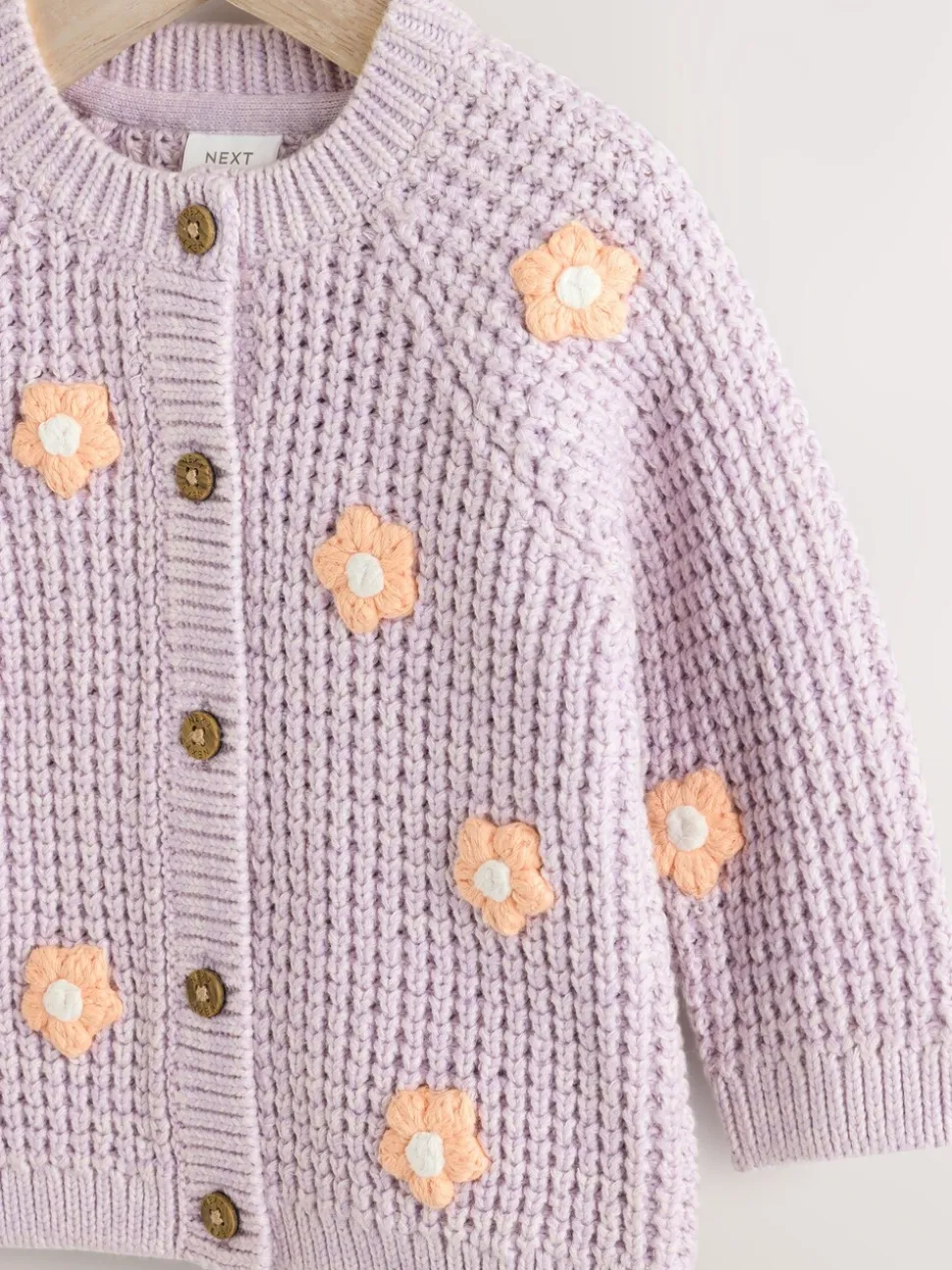 Paarse en abrikozenkleurige bloemen voor baby's - Geborduurd vest (0 mnd - 2 jr)