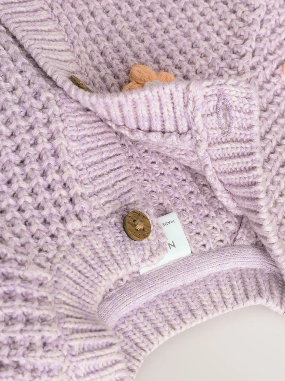 Paarse en abrikozenkleurige bloemen voor baby's - Geborduurd vest (0 mnd - 2 jr)