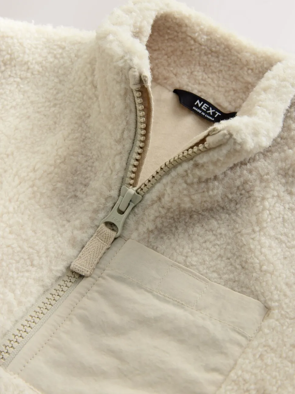 Pastelgeel - Effen fleece met rits en trechterhals (3mnd-7jr)
