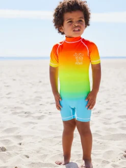 Regenboog dip-dye - Zonbeschermend onesie (3 mnd-7 jr)