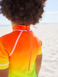 Regenboog dip-dye - Zonbeschermend onesie (3 mnd-7 jr)