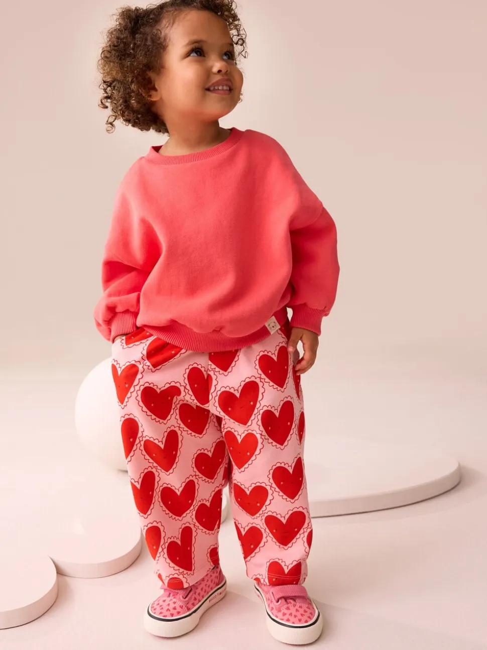 Rood met hartjesprint - Broek met structuur en wijde kortere pijpen (3mnd -7jr)