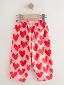 Rood met hartjesprint - Broek met structuur en wijde kortere pijpen (3mnd -7jr)