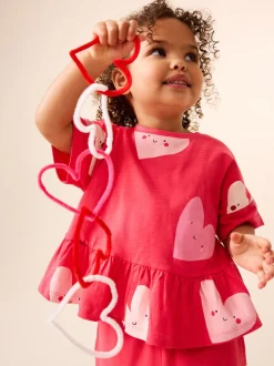Rood met hartjesprint - T-shirt met peplum en korte mouwen (3mnd -7jr)