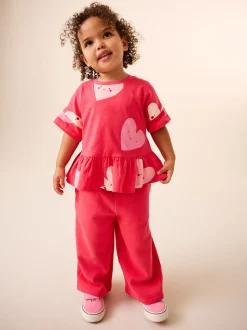 Rood met hartjesprint - T-shirt met peplum en korte mouwen (3mnd -7jr)