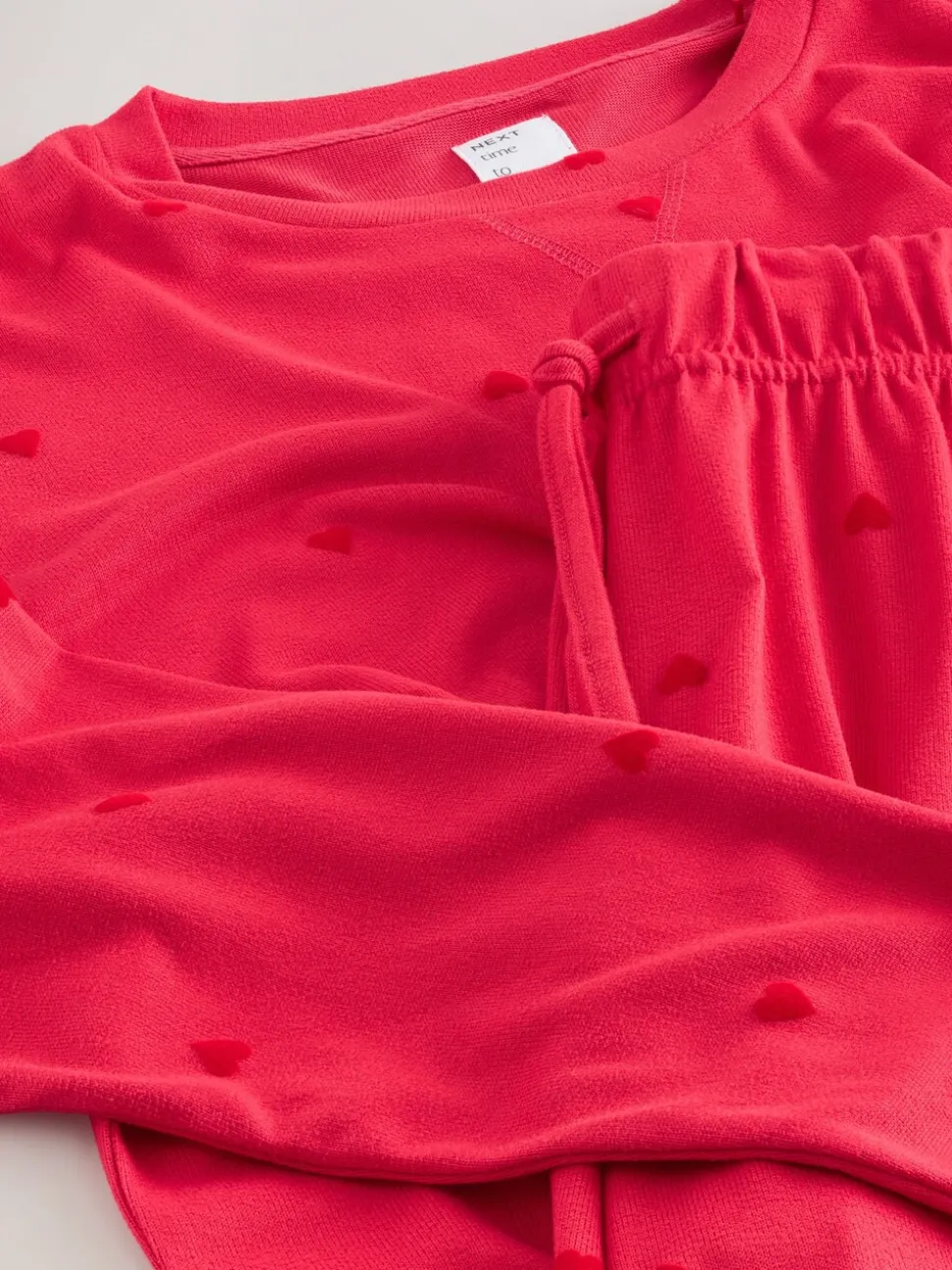 Rood met sterren - Zachte pyjama met lange mouwen en hartjesprint