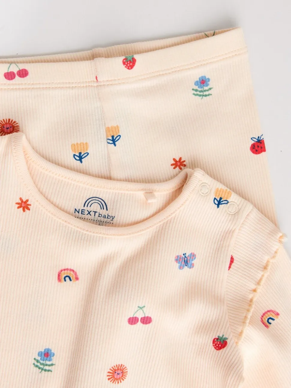 Roomkleurig met vrolijke figuurtjes - 2 -delige babyset van top en legging (0mnd -2jr)