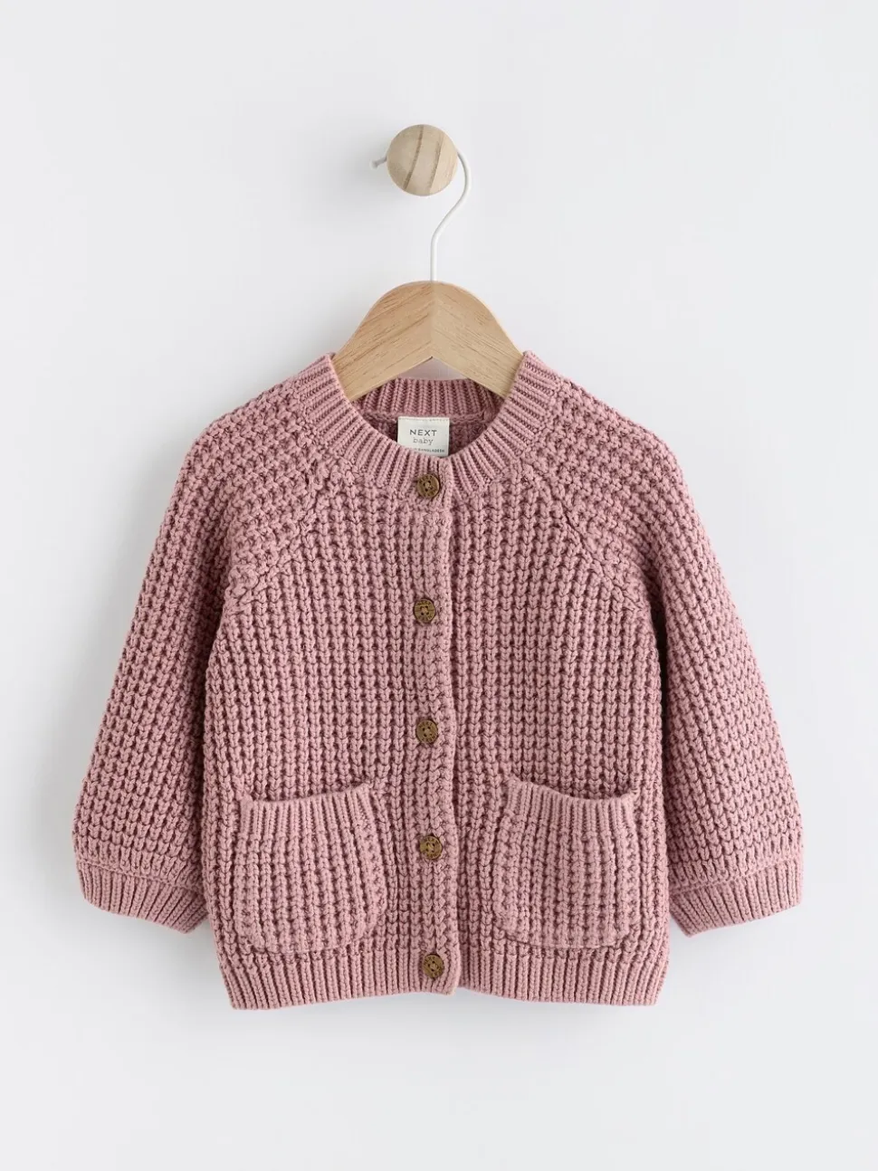 Roze - Gebreid babyvestje met geborduurde slogan op de rug (0mnd-2jr)