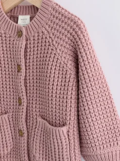 Roze - Gebreid babyvestje met geborduurde slogan op de rug (0mnd-2jr)