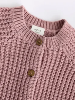 Roze - Gebreid babyvestje met geborduurde slogan op de rug (0mnd-2jr)