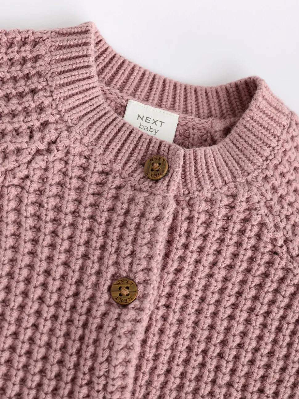 Roze - Gebreid babyvestje met geborduurde slogan op de rug (0mnd-2jr)