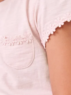 Roze - T-shirt met zakje en madeliefjesprint (1,5-16 jr)