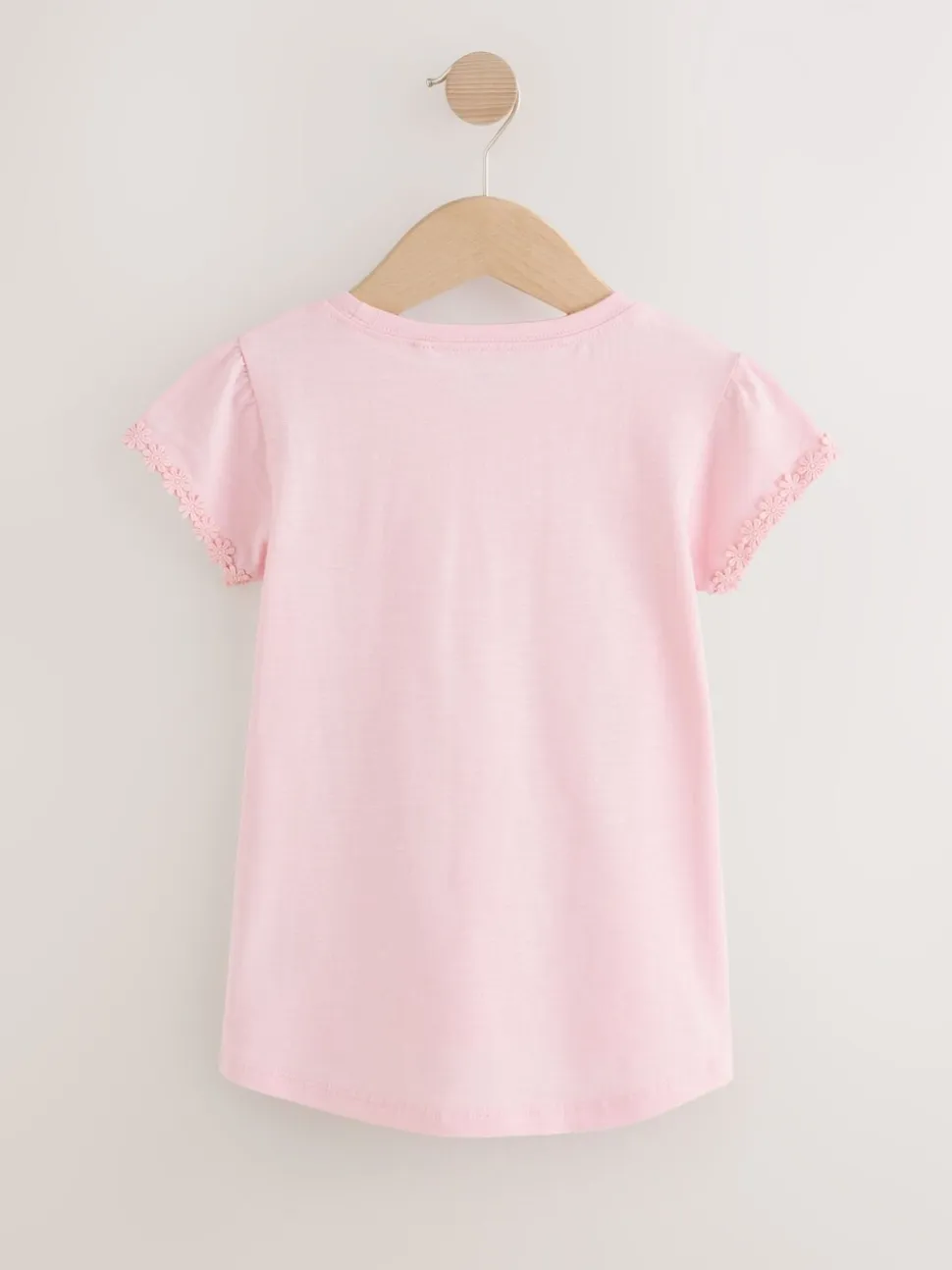 Roze - T-shirt met zakje en madeliefjesprint (1,5-16 jr)