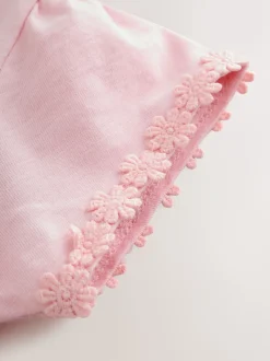 Roze - T-shirt met zakje en madeliefjesprint (1,5-16 jr)