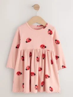 Roze lieveheersbeestje - Geribbelde jurk met lange mouwen (3mnd-7jr)