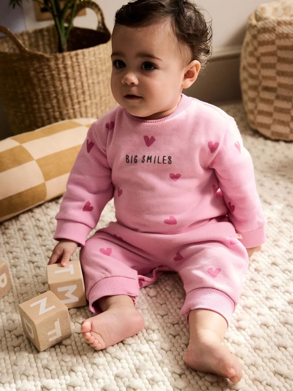 Roze met hartjesprint - Jersey babyromper (0mnd-3jr)