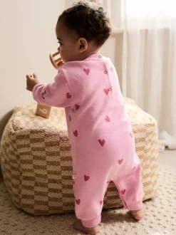 Roze met hartjesprint - Jersey babyromper (0mnd-3jr)