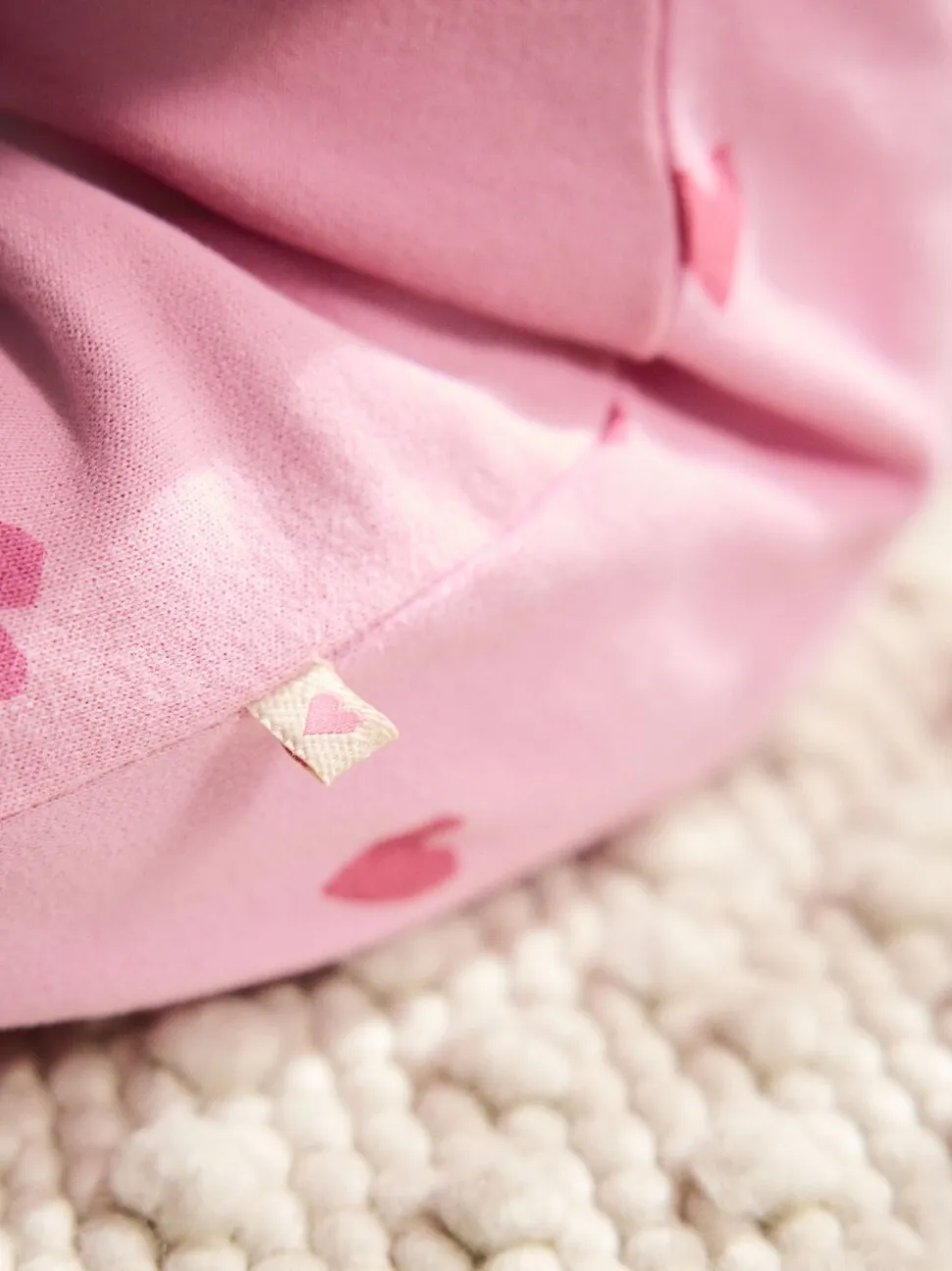 Roze met hartjesprint - Jersey babyromper (0mnd-3jr)