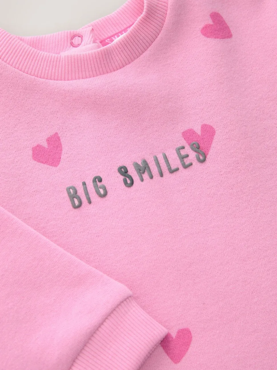 Roze met hartjesprint - Jersey babyromper (0mnd-3jr)