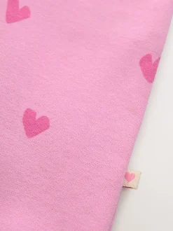 Roze met hartjesprint - Jersey babyromper (0mnd-3jr)