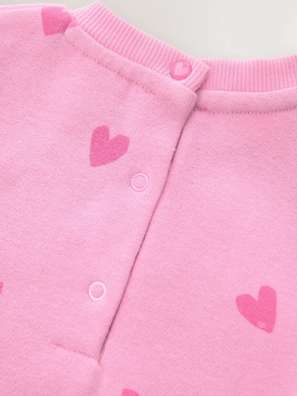 Roze met hartjesprint - Jersey babyromper (0mnd-3jr)