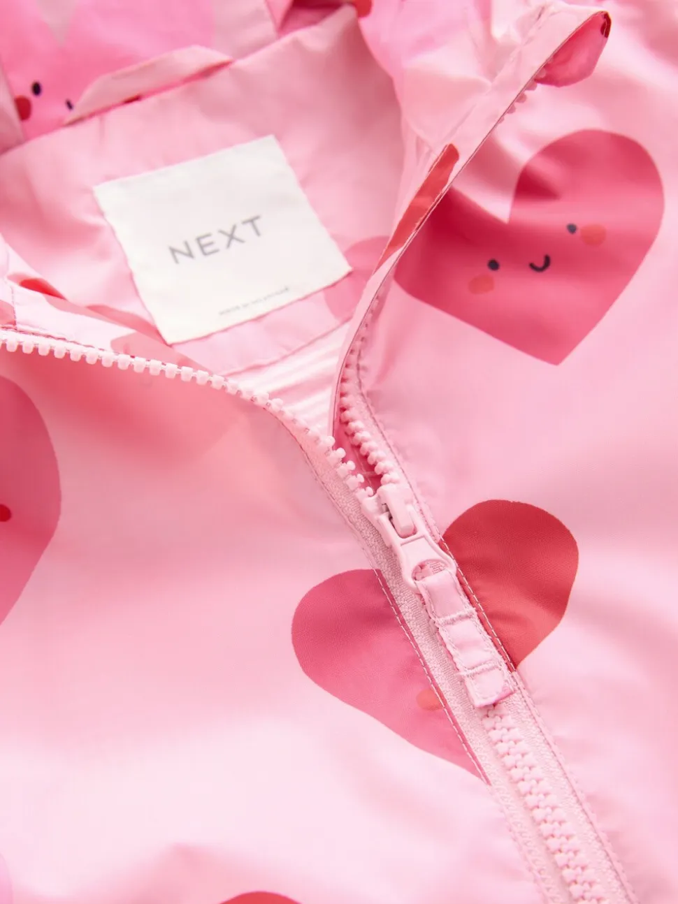 Roze met hartjesprint - Regenbestendig jack met print (3mnd-7jr)